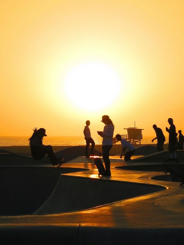 Venice Beach visitors at sunset